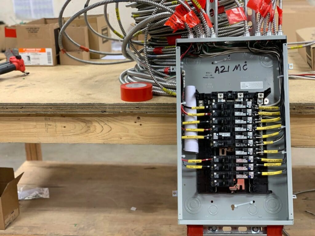 Open electrical breaker panel showing organized wiring during inspection by a licensed electrician near me